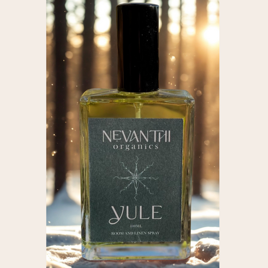 Nevantii Organics Yule room and linen spray bottle with a forest background