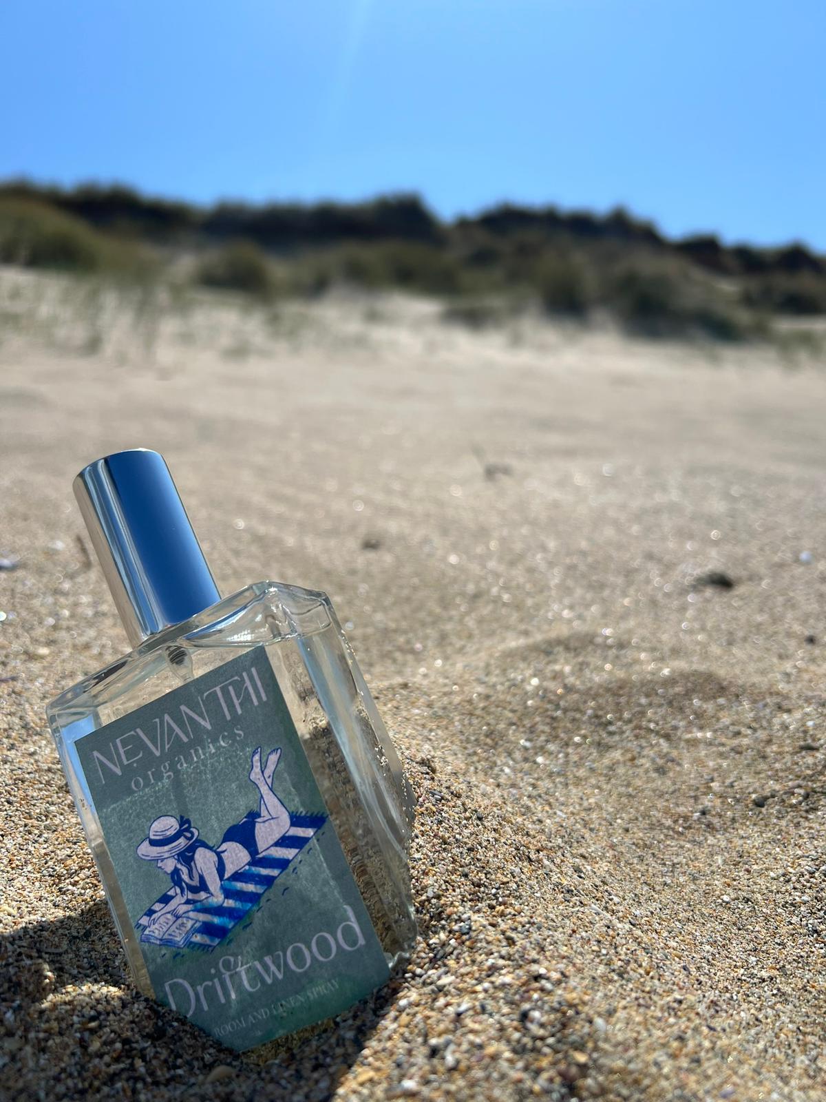 Driftwood room and linen spray by Nevanthi Organics — summer seasonal sage and sea salt fragrance photographed on Norfolk beach sand dunes